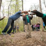 Adults doing activities at a group retreat