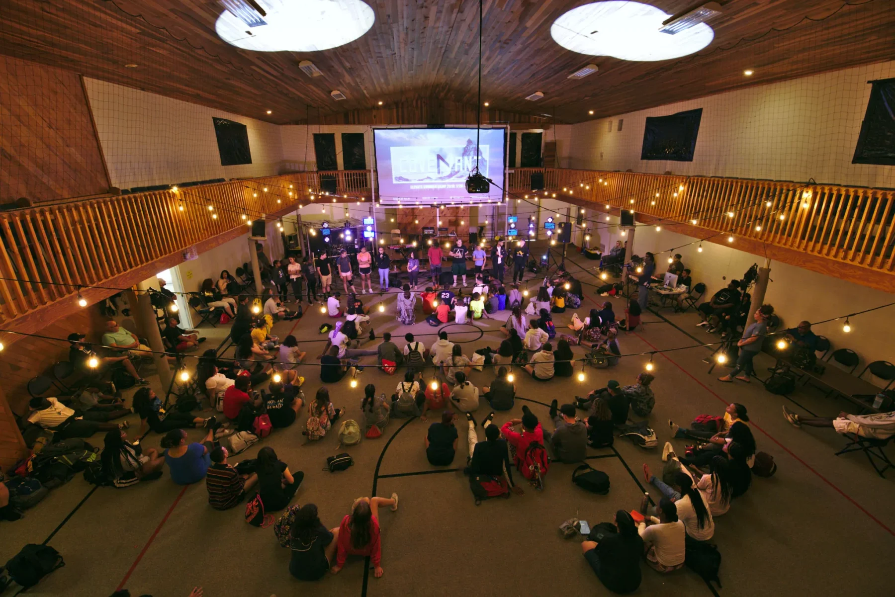 People attending a retreat in Refreshing Mountain's gymnasium aerial meeting room