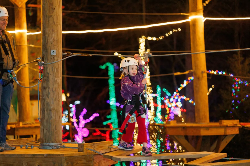 A Small Girl On The High Ropes Elevated Obstacle Course At Refreshing Mountain