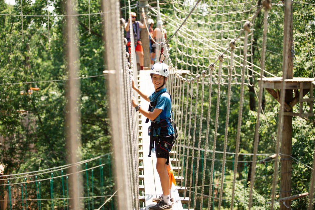 Things To Do In Lancaster, Pa For Families, Groups, &Amp; Teams: Boy Walking Over Foot Bridge To The Zipline.